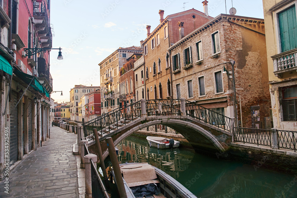 Venice, Italy - October 13, 2021: Bridge over the canal in Venice. Streets of the Italian city of Venice