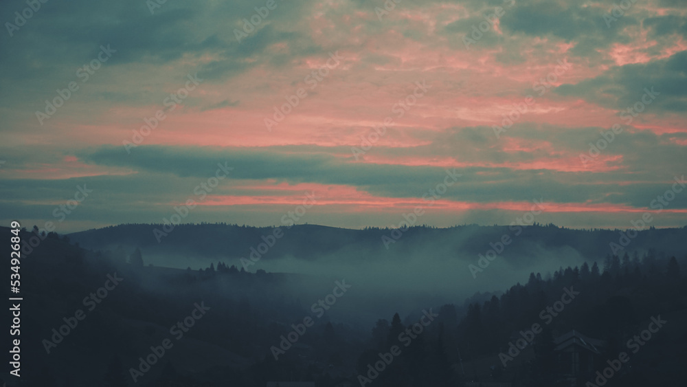 Fototapeta premium Carpathian mountains with fog at dawn