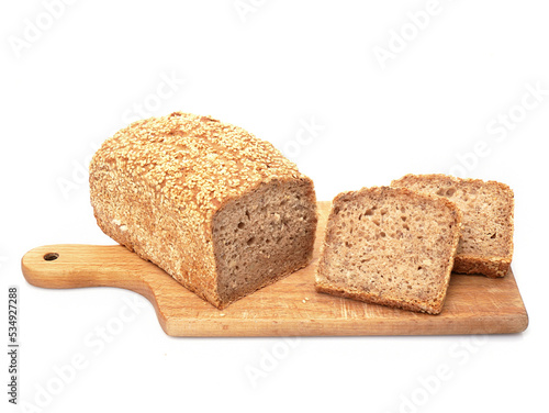 Healthy bread made of spelled flour and sesame seeds. Isolated on white background. 