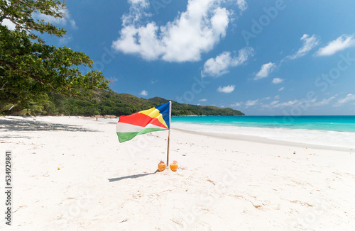 The flag of Seychelles on Anse Lazio photo
