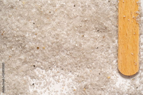 Grains of sand in a white paper