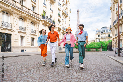 Canvas Print Multiethnic group of young happy teens friends bonding and having fun while visi