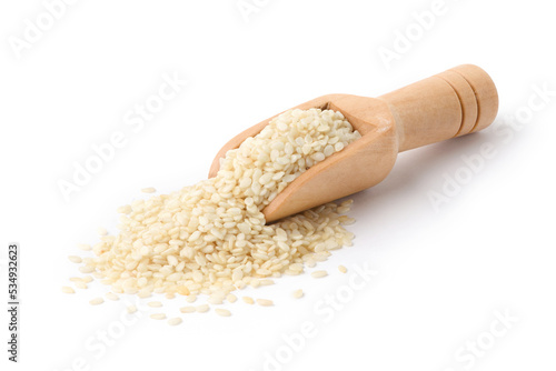 White sesame seeds with wooden scoop isolated on white background.