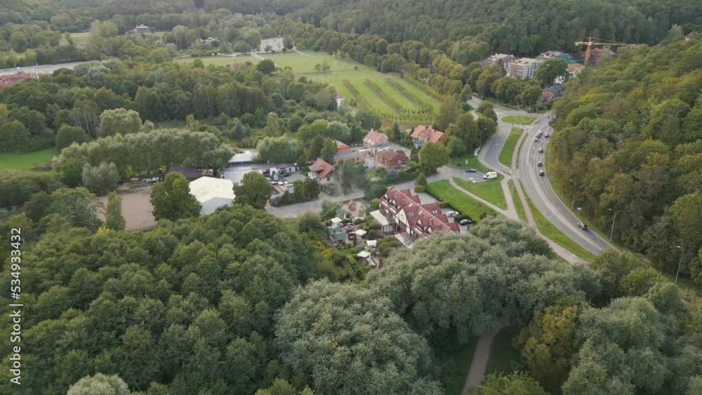 Aerial view of town. Flight over Oliwa district during the day. Parks and buildings in the background. Aerial view of town. Flight over Oliwa district during the day. Parks and buildings in the background.