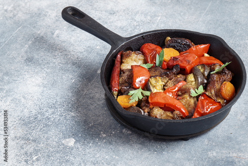 Baked meat with vegetables in a pan