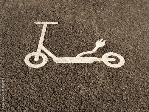 e-scooter icon marks the area on the roadside where the scooters should be parked. photo