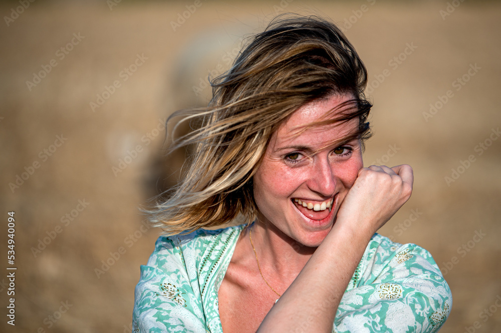 Happy female wiping mouth and smiling