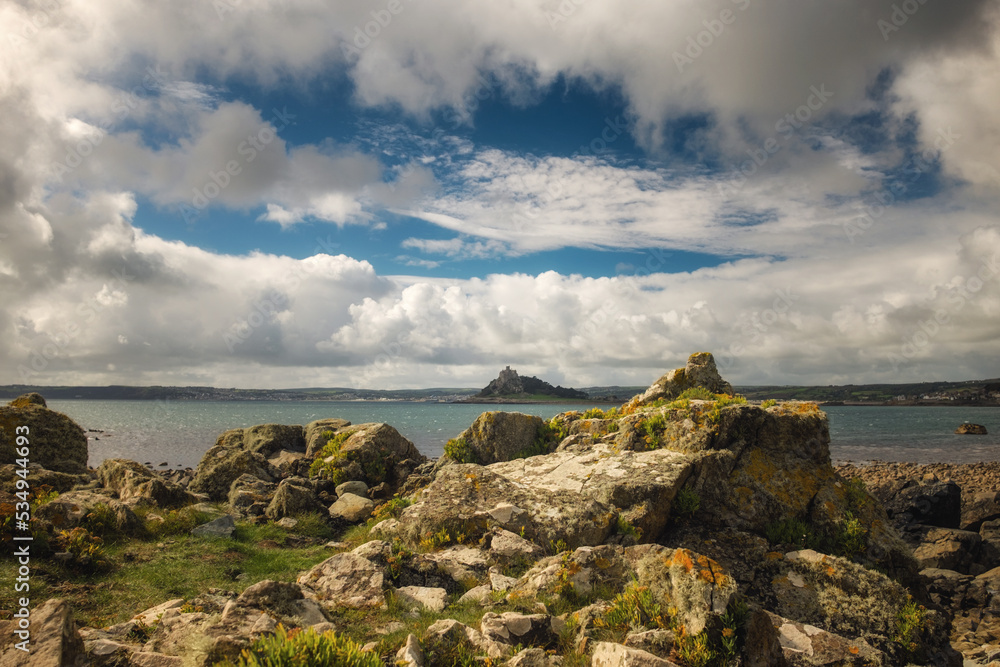 St Michael's Mount seen from the rocky Cornish coast.