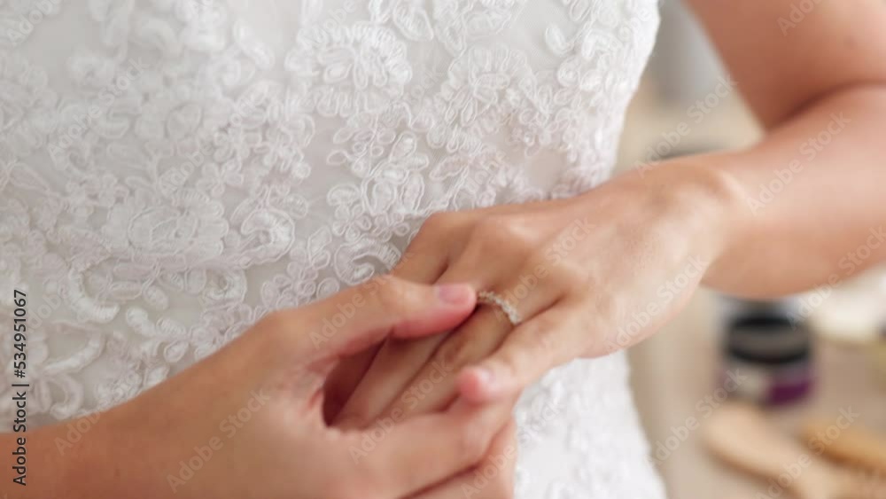 Nervous, anxiety and scared bride at wedding looking at her ring in a room. Thoughtful young woman thinking about future, life and marriage partner with fear, mistake and worry about being a wife Nervous, anxiety and scared bride at wedding looking at her ring in a room. Thoughtful young woman thinking about future, life and marriage partner with fear, mistake and worry about being a wife