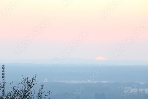 Fototapeta Naklejka Na Ścianę i Meble -  View over Aschaffenburg in Bavaria. View of the sunset on the horizon, great landscape with a city in winter