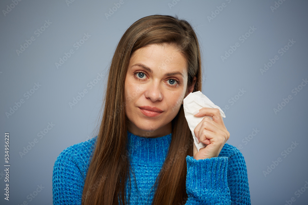 Woman with runny nose using white napkin. Isolated female portrait with cold sick. Woman with runny nose using white napkin. Isolated female portrait with cold sick.