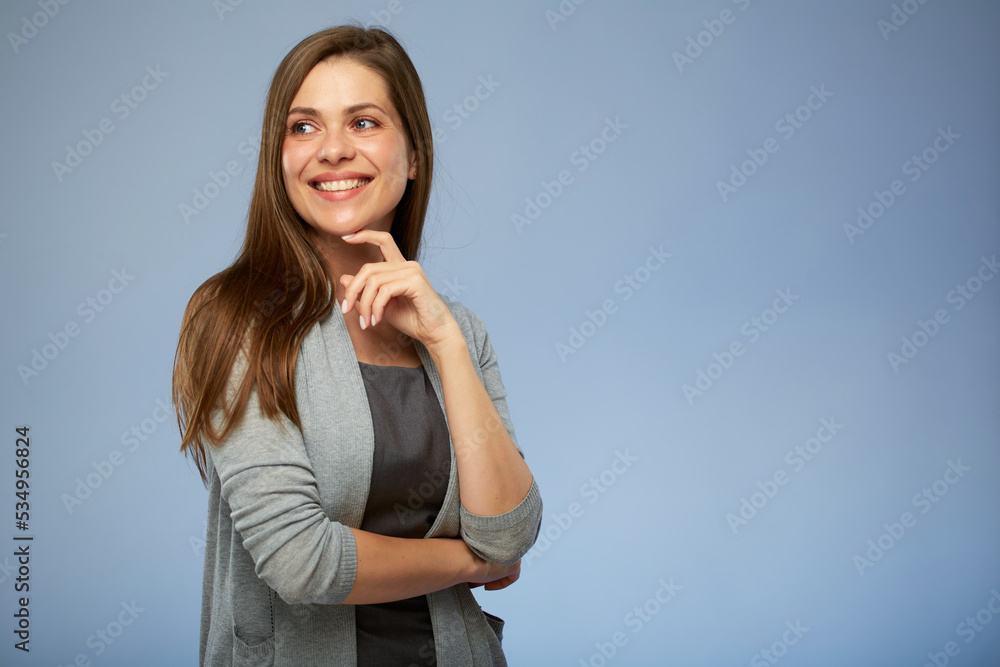 Thinking smiling business woman touching her face, looking left side. isolated portrait. Thinking smiling business woman touching her face, looking left side. isolated portrait.