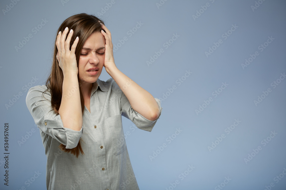 Young woman with headache touching head. isolated female portrait with eyes closed. Young woman with headache touching head. isolated female portrait with eyes closed.