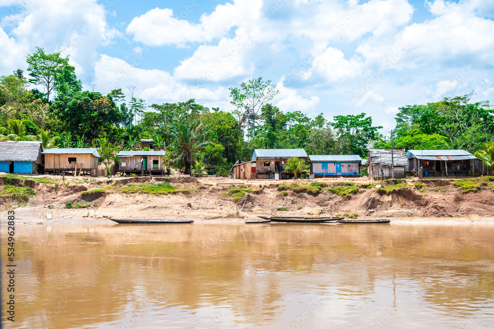 shanty village at peruvian amazon riverbank shanty village at peruvian amazon riverbank