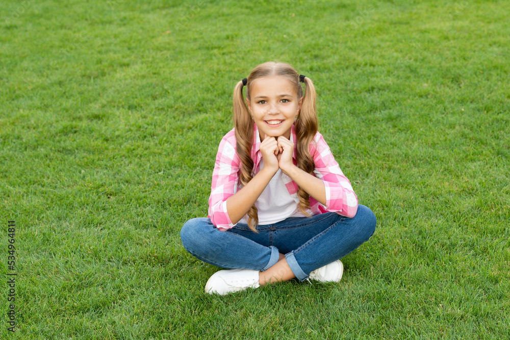smiling teen kid sit on green grass outdoor smiling teen kid sit on green grass outdoor