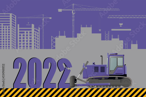 Outgoing 2022 bulldozer rattles against the background of a construction site.