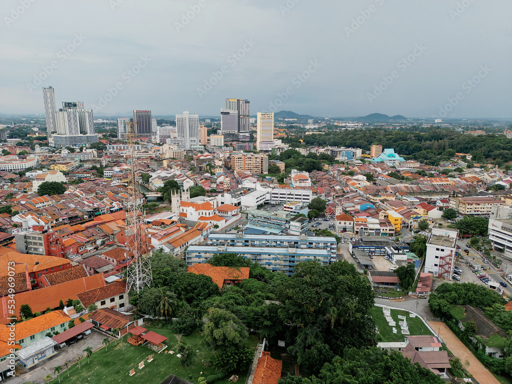 Malacca, Malaysia. Aerial view of city homes, river and skyline from drone on a clear sunny day