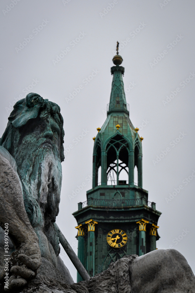 Fototapeta premium Head of Neptune from the baroque Neptune Fountain near Alexanderplatz in front of St. Mary's Church