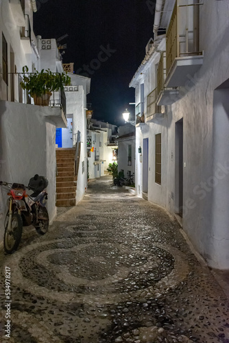 Quiet street of the town of Frigiliana, a traditional white village in the mountain of the coast of Malaga, Spain./Pueblo blanco de la costa de Malaga, Frigiliana, España