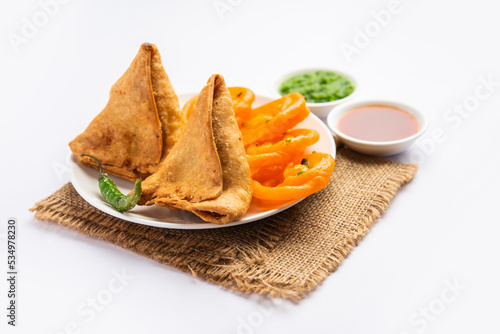 Veg Samosa with Jalebi, snack combination also called imarti and Sambusa, samusa photo