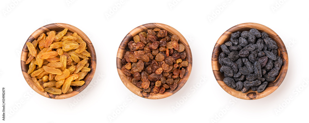 Wooden bowls with raisins as ingredient for tasty dessert Wooden bowls with raisins as ingredient for tasty dessert