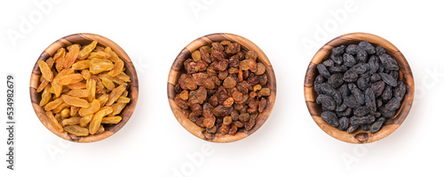 Wooden bowls with raisins as ingredient for tasty dessert