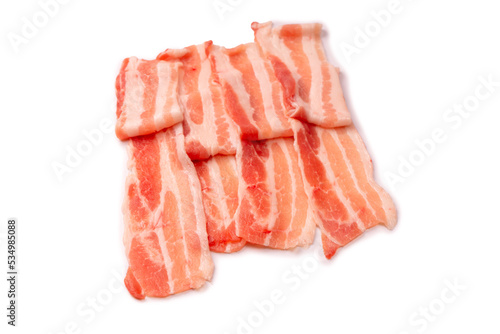 Raw bacon slices isolated on a white background.