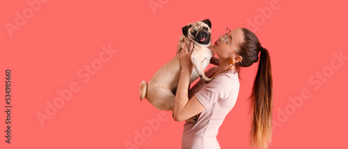 Teenage girl with cute pug ...