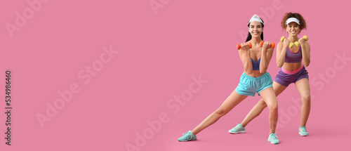 Fototapeta Naklejka Na Ścianę i Meble -  Young women doing aerobics on pink background with space for text
