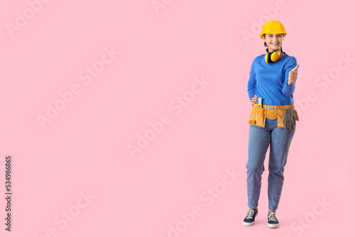 Female builder with hardhat...