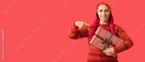 Beautiful woman pointing at...