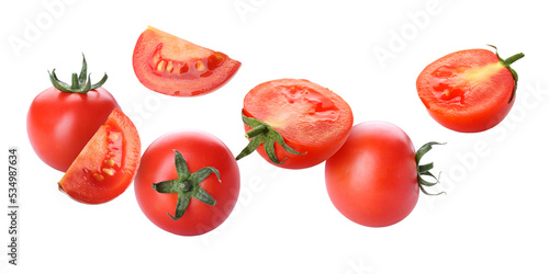 Fresh flying tomatoes isolated on white