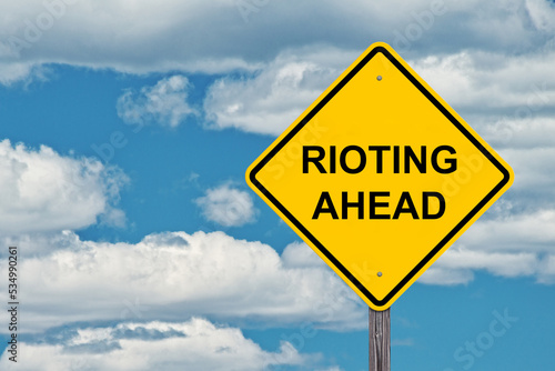 Rioting Ahead Warning Sign