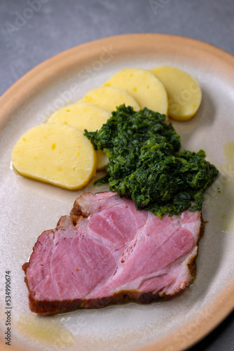 smoked meat with spinach and potato dumplings