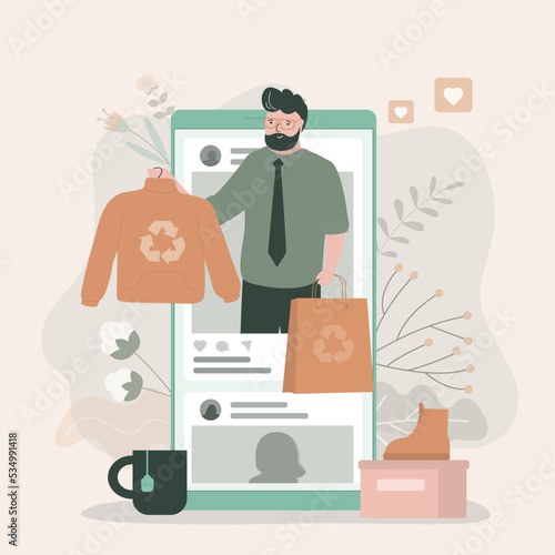 Influencer talks about eco fashion and recycled clothing. Fashion man in social networks discusses movement of zero waste. Young adult talks about green lifestyle. Phone with social media feed.