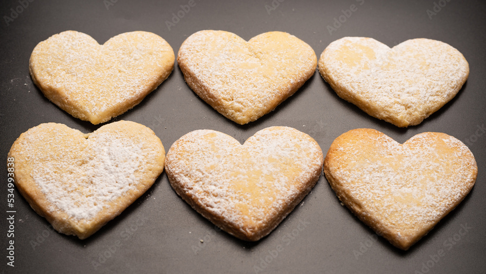 Shortbread in the shape of a heart isolated on white background. Shortbread in the shape of a heart isolated on white background.