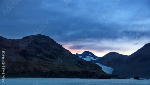 Sunset over a glacier in the mountains near Fortuna Bay, South Georgia Island © Angela