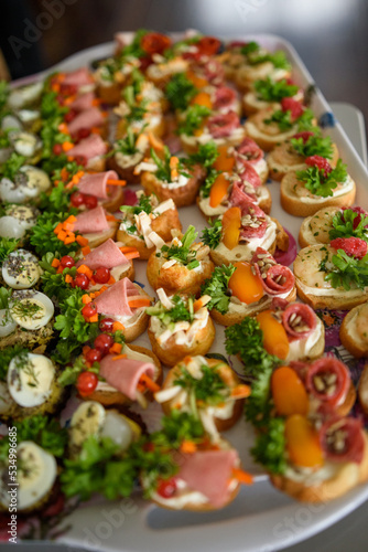 Close-up of assorted canapes on a serving dish photo