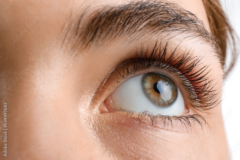 Young woman with beautiful hazel eyes on white background, closeup Young woman with beautiful hazel eyes on white background, closeup