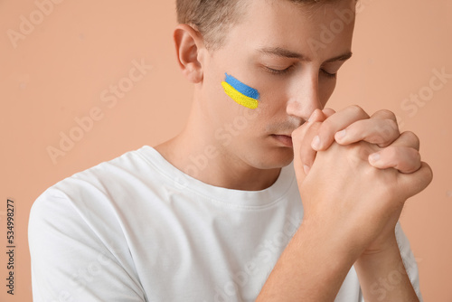Young man with drawn flag o...