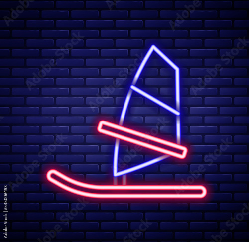 Glowing neon line Windsurfing icon isolated on brick wall background. Colorful outline concept. Vector
