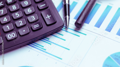 Charts and graphs are placed on the desks, data, and statistical performance of the company in the past year.