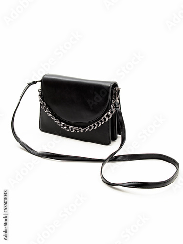 Black women's leather shoulder bag with long strap on white background