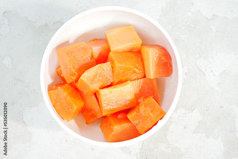slice of papaya on white plate , slice of papaya on white plate ,