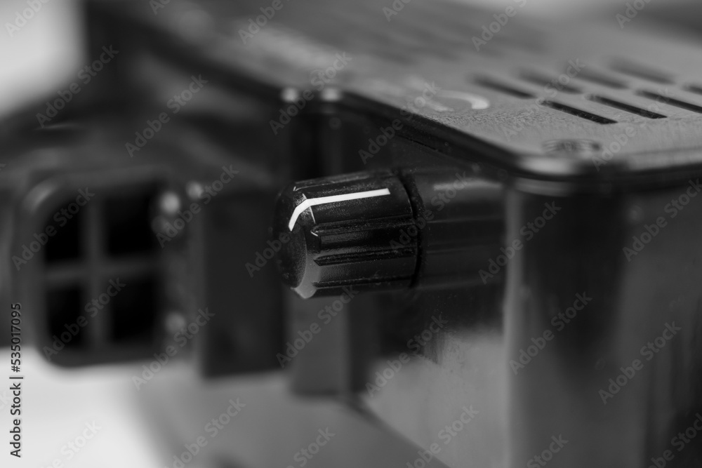 Black electrical appliance with adjusting turning knob Black electrical appliance with adjusting turning knob