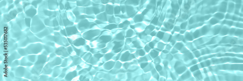 Fresh water background. Bright blue pattern with rippled water texture and splashes. Top view web banner. Clear water surface background.