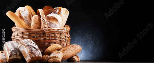 Wicker basket with assorted bakery products photo