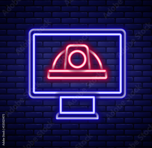 Glowing neon line Worker safety helmet icon isolated on brick wall background. Colorful outline concept. Vector