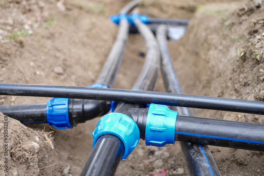 Connecting water supply plastic pipes on ground