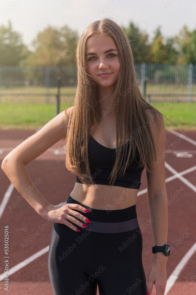 Young woman athlete runnner at the stadium outdoors Young woman athlete runnner at the stadium outdoors